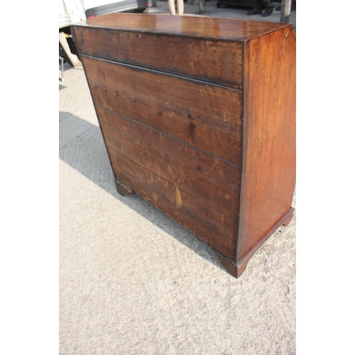 468 - A late Georgian mahogany fall front bureau, the fitted interior over four long graduated drawers wit... 