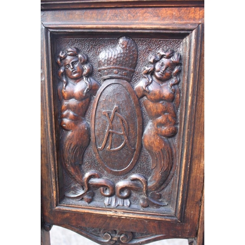 472 - A 19th century Renaissance revival carved walnut side chair with panel back monogrammed 