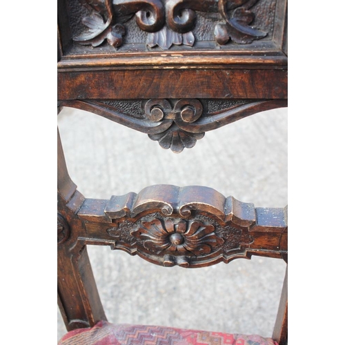 472 - A 19th century Renaissance revival carved walnut side chair with panel back monogrammed 