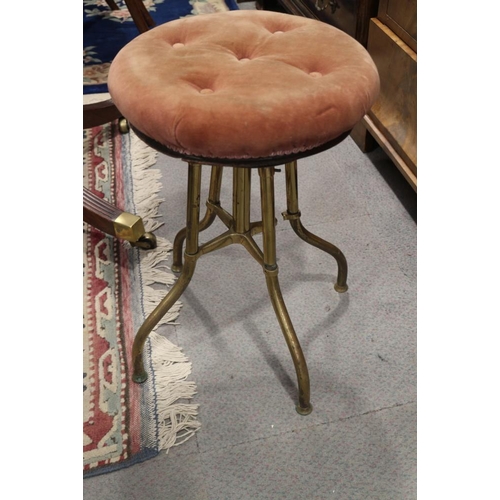 547 - An early 20th century brass framed piano stool with adjustable seat