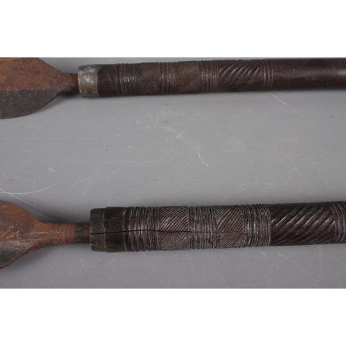 120 - Two East African carved hardwood spears, 40