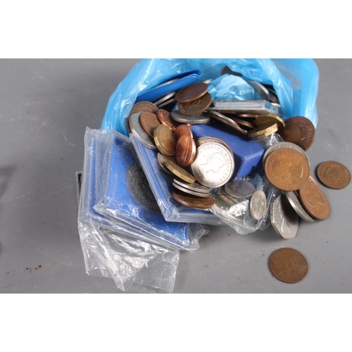 324 - A selection of costume jewellery, including two watches, and various coinage