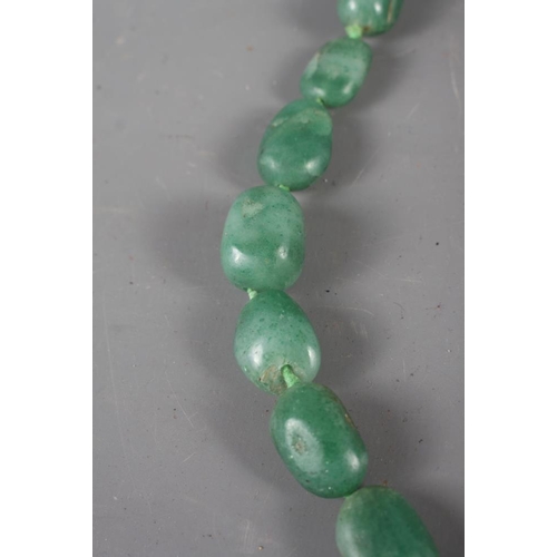 327 - A jadeite graduated pebble bead necklace, 36