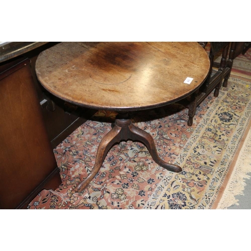 403 - A 19th century mahogany circular tilt top low occasional table, on turned column and tripod splay su... 