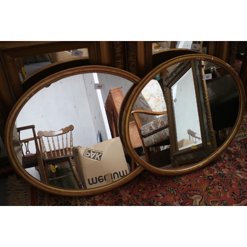 494 - A pair of oval gilt framed wall mirrors, 20 1/2