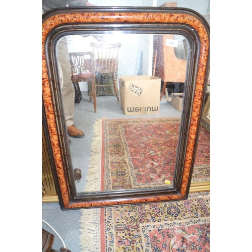 499 - A rectangular shaped overmantel mirror with ebonised and tortoiseshell effect frame, 25