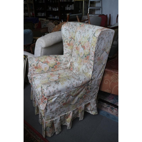 529 - A wing-back armchair with floral loose cover, a showframe nursing chair and an oak footstool