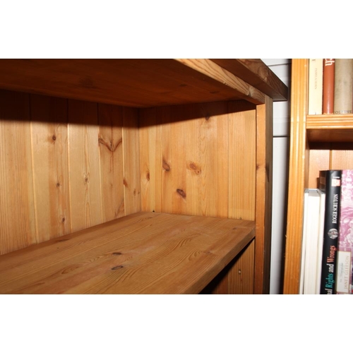 604 - A pine open bookcase, fitted adjustable shelves, 62