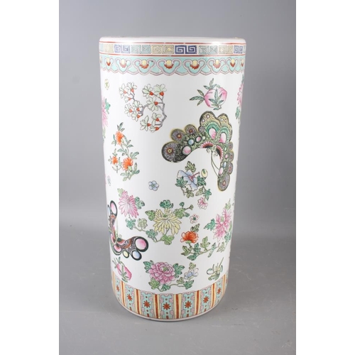 103 - A Chinese ceramic stick stand with insect and flower decoration, 18