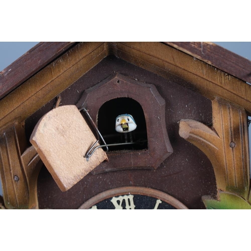 125 - A wooden cased cuckoo clock, 8 1/2