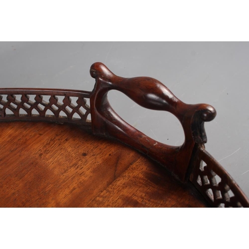 171 - A late 19th century figured mahogany two-handled tray with pierced gallery, 29