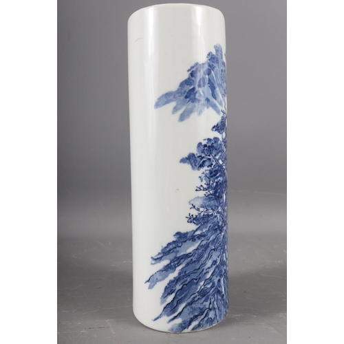 107 - A Japanese blue and white oval shaped vase, decorated trees and figures in a boat (hairline crack), ... 