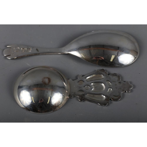 304 - A modern silver dog-nose caddy spoon and another modern silver caddy spoon with Celtic style handle,... 