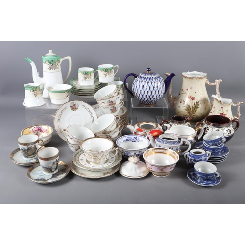 77 - A Russian blue, white and gilt decorated teapot, a Noritake part coffee set, Limoges cups and saucer... 