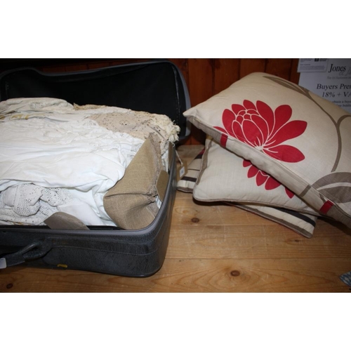 197 - Two suitcases containing a quantity of linen and lace