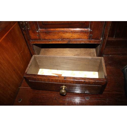 413 - An oak dresser, the upper section fitted two open shelves, two cupboards and two drawers, over three... 