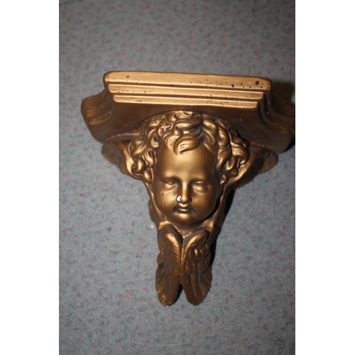 220 - A pair of gilt plaster cherub wall brackets, 11