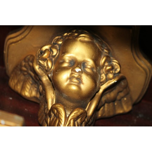 220 - A pair of gilt plaster cherub wall brackets, 11