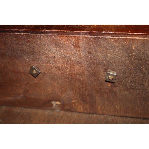 448 - A late Georgian mahogany chest of four long graduated drawers with brass bail handles, on bracket fe... 