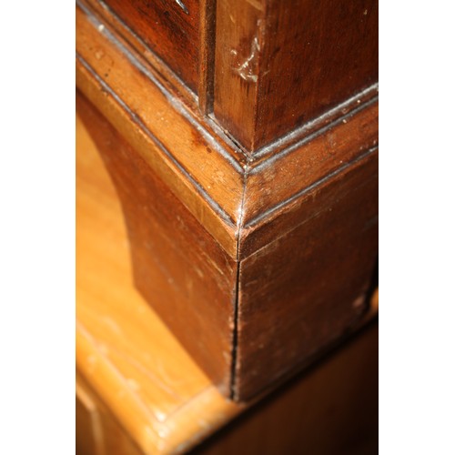 448 - A late Georgian mahogany chest of four long graduated drawers with brass bail handles, on bracket fe... 