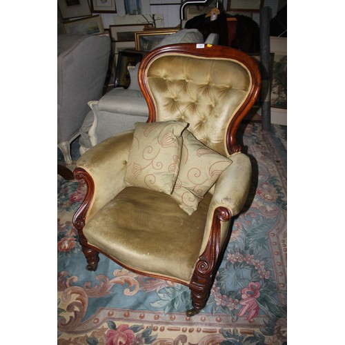 393 - A Victorian mahogany show frame balloon back armchair button upholstered in green velour on turned a... 