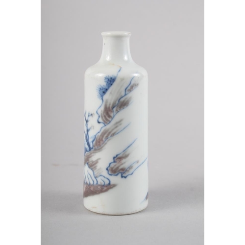 100 - A Chinese porcelain cylindrical snuff bottle, decorated with a fisherman, six character mark to base... 