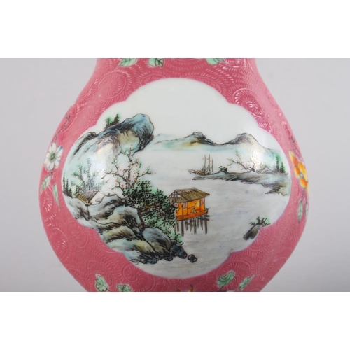 103 - A Chinese porcelain vase-shaped wall pocket with landscape panel on a pink ground, 10 1/2