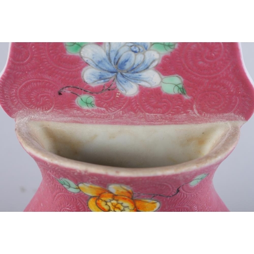 103 - A Chinese porcelain vase-shaped wall pocket with landscape panel on a pink ground, 10 1/2