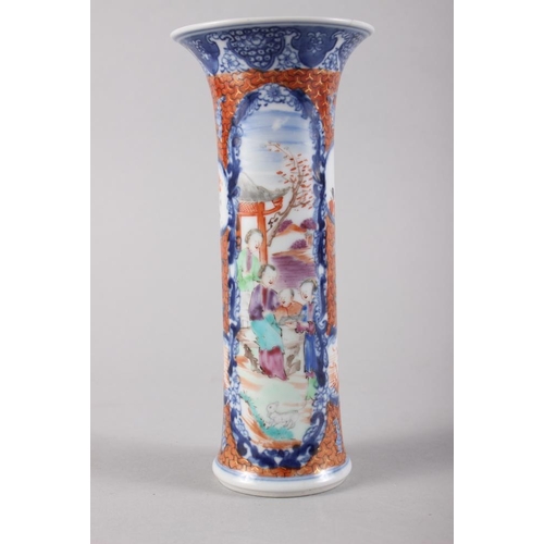 110 - A Chinese polychrome decorated flared rim vase with panel and figure decoration, 7 3/4