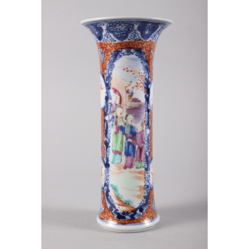 110 - A Chinese polychrome decorated flared rim vase with panel and figure decoration, 7 3/4