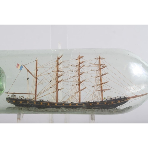 182 - A late 19th century French ship in a bottle, four mast schooner, 13