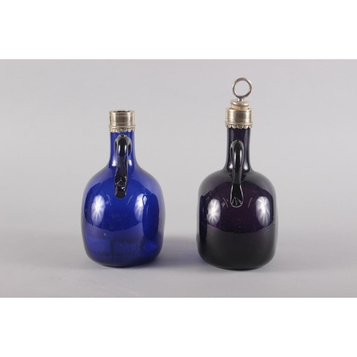 23 - An amethyst glass and metal mounted bottle with stopper, 7