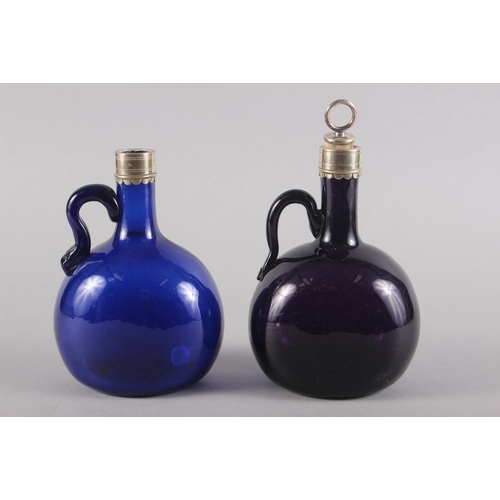 23 - An amethyst glass and metal mounted bottle with stopper, 7