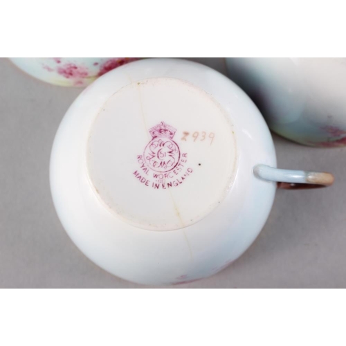 25 - A Royal Worcester cabaret teaset with pink floral decoration and gilt borders, ten pieces approx (cr... 