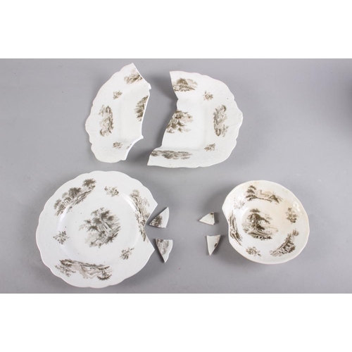 34 - An early 19th century bone china part teaset with bat printed landscape decoration (some damages)