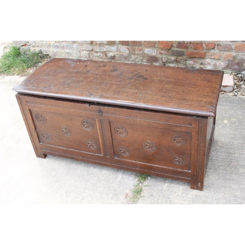 375 - An early 18th century oak chip carved panel front coffer with candlebox, on stile supports, 41