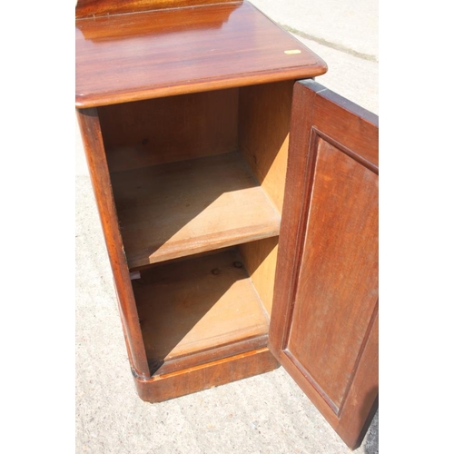 382 - A late 19th century mahogany ledge back bedside cupboard enclosed panel door, on block base, 15