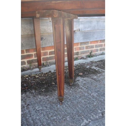 398 - A 19th century mahogany and box line inlaid extending dining table with two leaves, on square taper ... 