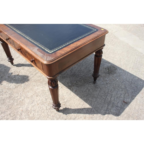 400 - A 19th century walnut library table with tooled lined top, fitted two drawers, on turned and fluted ... 