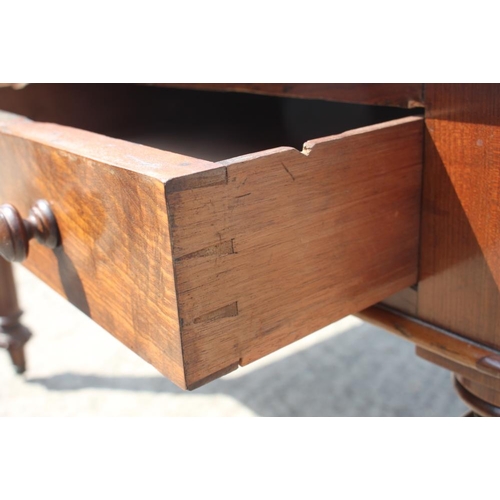 400 - A 19th century walnut library table with tooled lined top, fitted two drawers, on turned and fluted ... 