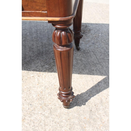 400 - A 19th century walnut library table with tooled lined top, fitted two drawers, on turned and fluted ... 