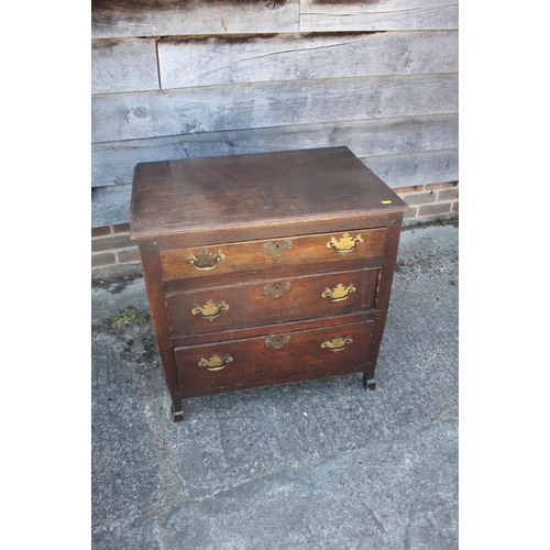 406 - A late 18th century provincial oak chest of three long drawers, on shaped supports, 25