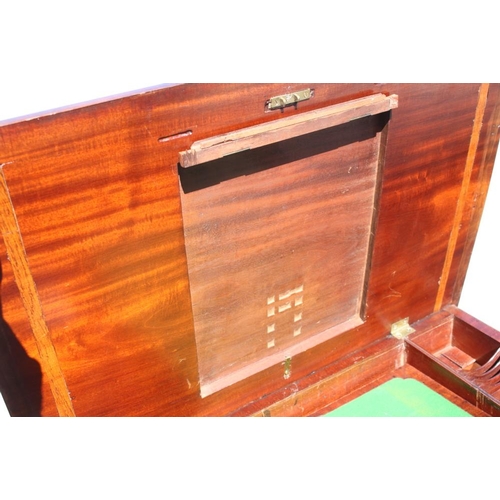 407 - A Georgian mahogany kneehole writing desk with lift-up lid and fitted interior over six drawers and ... 