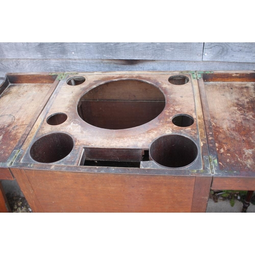 410 - A Georgian mahogany wash stand with fitted interior, over cupboard (drawer missing), 18