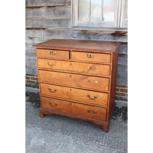 444 - A late Georgian provincial fruitwood chest of two short and four long graduated drawers with bail ha... 