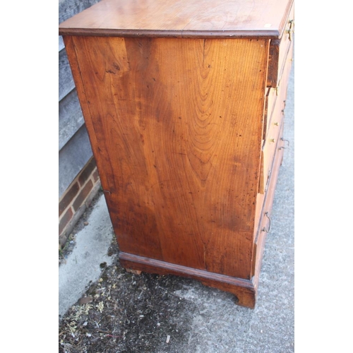 444 - A late Georgian provincial fruitwood chest of two short and four long graduated drawers with bail ha... 