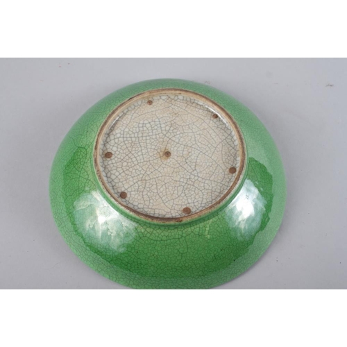 91 - A Chinese green crackle glazed shallow dish, 8 1/2