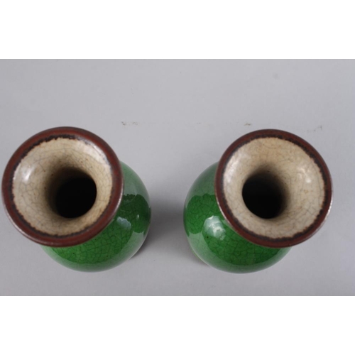 97 - A pair of Chinese  green crackle glazed baluster vases, 9