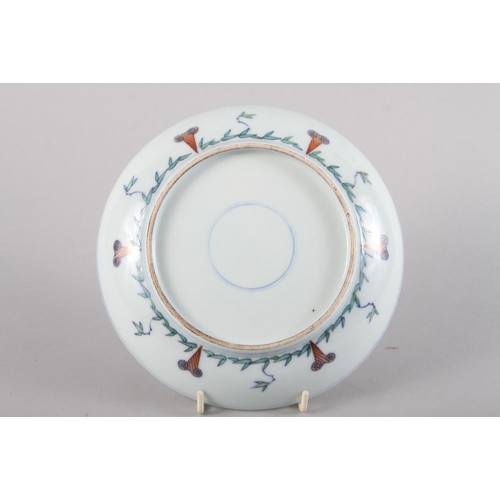 99 - An 18th century Chinese porcelain Doucai shallow dish, decorated flora and fauna, 7 1/2