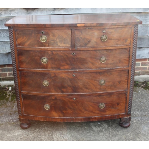 380 - A Victorian figured mahogany bowfront chest of two short and two long drawers with brass ring handle... 